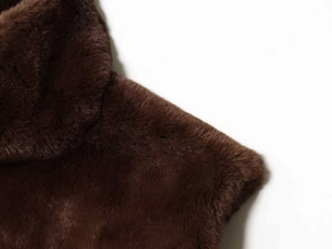 Close-up of the soft dark brown faux fur texture on this versatile autumn vest