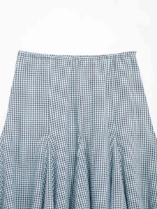 Detail view of plaid midi skirt with blue and brown gingham pattern and elastic waist