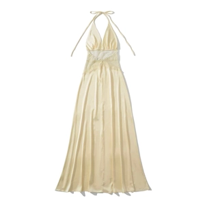 Detail of champagne satin maxi dress featuring V-neck and delicate lace waist inserts