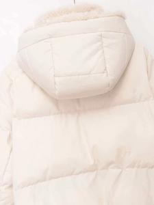 Close-up of winter fleece-lined hood on a cream-white padded jacket with quilting details