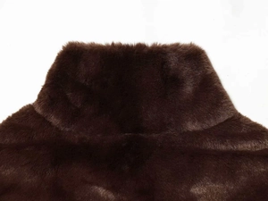 Close-up of the soft dark brown faux fur texture and collar detail on the vest