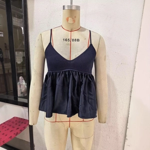 Navy blue V-neck knit camisole with silk-like ruffled hem and slim fit design