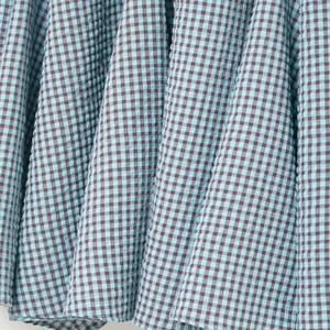 Blue and brown checkered seersucker skirt featuring irregular textured plaid fabric