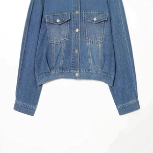 Classic loose fit vintage washed blue denim jacket with double chest pockets and metal buttons