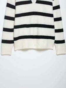 Detail of soft fuzzy knit fabric with classic black and white horizontal stripes