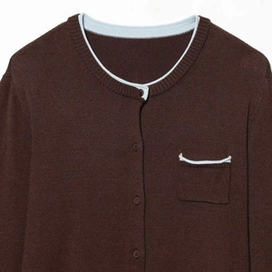 Women's brown knit cardigan with blue trim, crew neck design and pocket detail