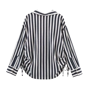 Women's vertical black and white striped long sleeve shirt with side drawstring detail