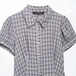 Minimalist grey gingham short-sleeve button-up dress with puff sleeves and lapel collar