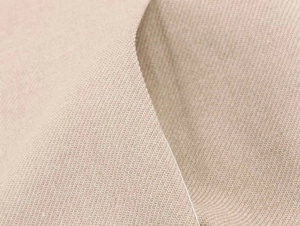 Dettaglio ravvicinato della trama in tela beige per giacca blazer elegante