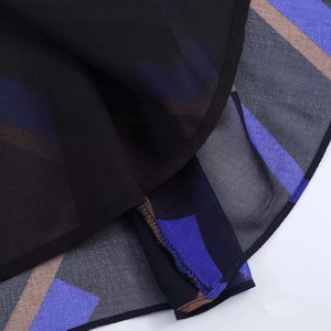 Macro shot of geometric print chiffon midi skirt with hem stitching and inner lining