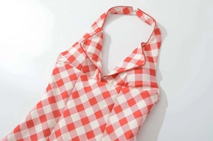 Detailed view of red gingham halter neck dress with V-neckline and collar detail