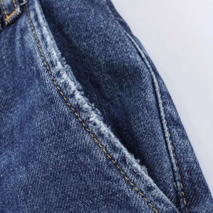 Classic blue straight leg jeans featuring distressed side pocket details and yellow stitching