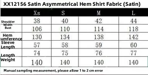 Size guide table for satin asymmetric shirt showing shoulder, chest and sleeve measurements