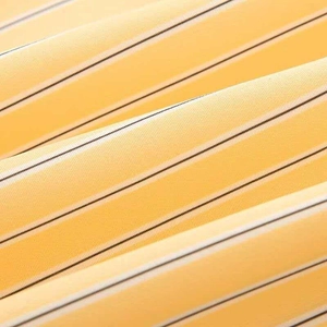 Macro shot of breathable yellow fabric with elegant black and white striped pattern texture