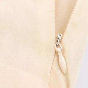 Chic beige midi dress featuring a seamless invisible zipper and textured crepe fabric