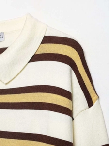 Detailed view of striped knit sweater collar with beige, brown and ginger yellow stripes