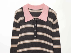 Detailed view of pink polo collar and resin buttons on a striped knit sweater garment