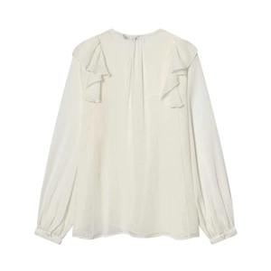 Elegant white long sleeve blouse with ruffled shoulder details and textured fabric