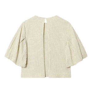 Detail of checkered blouse featuring open back design and pleated puff sleeves