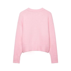 Detailed back view of pink crewneck knit sweater with ribbed cuffs and drop shoulder