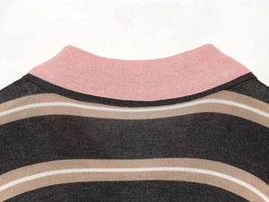 Detail of pink ribbed lapel collar on gray and white striped knit sweater for women