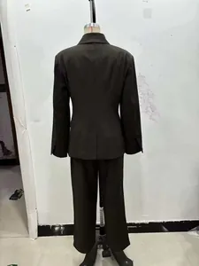 Rear view of loose fit dark charcoal women blazer set with back vent and straight trousers