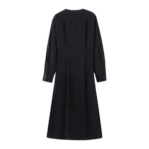 Rear view of black long-sleeve dress with waist pleats and A-line silhouette details