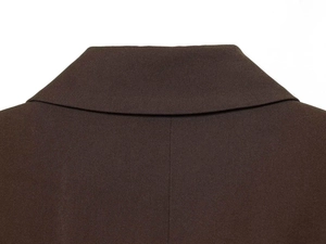Close-up of the rear collar and fine twill texture of a dark brown draped blazer jacket
