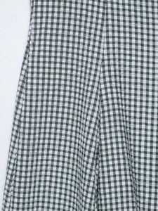 Detail shot of green and white gingham fabric with a seersucker textured weave pattern