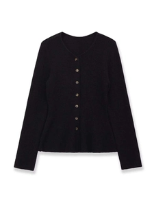 Detail of classic black knit cardigan featuring amber-textured buttons and fine knit texture