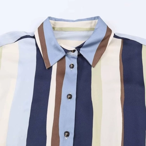 Detailed close-up of multi-color vertical stripes shirt collar and front buttons