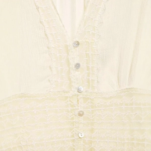 Elegant cream chiffon top with deep V-neck, delicate lace trim and pearlescent buttons