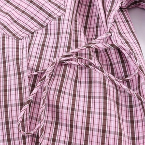 Pink and black gingham check shirt featuring a stylish waist tie detail for women