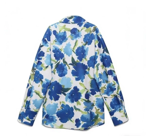 Detail view of the back of a satin floral shirt with blue watercolor flower patterns