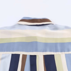 Detail of multi-color striped shirt collar and woven fabric texture in macro view