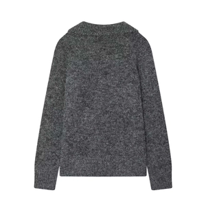 Close-up of the dark grey knitted sweater back with soft wool texture and ribbed cuffs