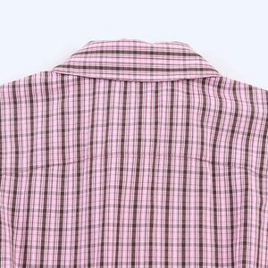 Detailed close-up of pink and brown checkered shirt collar with fine fabric texture