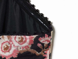Detail of floral dress with black bobble trim and premium smooth inner lining