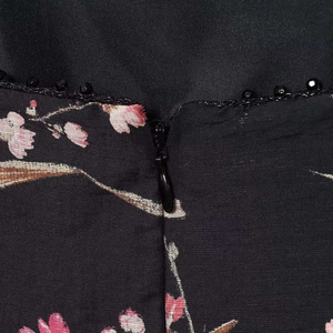 Black floral summer dress featuring hidden back zipper and delicate bead trim details