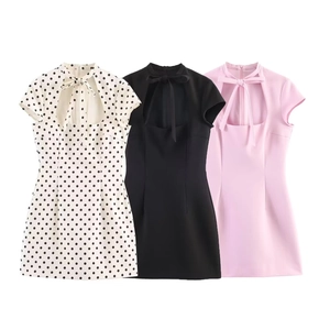 Detail of slim-fit mini dress with bow-tie collar and cutout in three color options