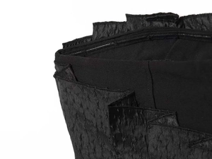 Detail of charcoal black textured bandeau top featuring non-slip silicone inner lining