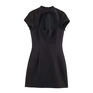 Detail of black short-sleeve mini dress with chic bow tie neckline and cut-out design