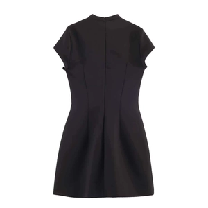 Detail view of the black short dress back with invisible zipper and elegant stand collar