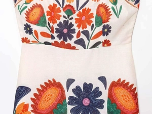 Detailed view of summer dress floral print on linen cotton fabric with seam details