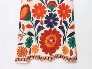 Detailed macro view of vintage floral print on textured cotton linen summer dress fabric