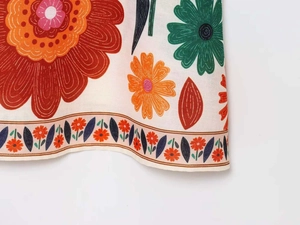 Close-up of vintage floral print on breathable cotton linen summer dress fabric