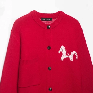 Classic red knit cardigan with white horse embroidery and button closure on white background