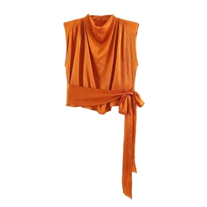 Bright orange sleeveless top featuring a high neck and pleated texture with a waist tie