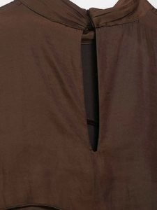 Detail of dark brown satin dress featuring back button closure and teardrop keyhole cutout