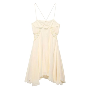 Light yellow spaghetti strap dress with lace panels and asymmetrical hem detail